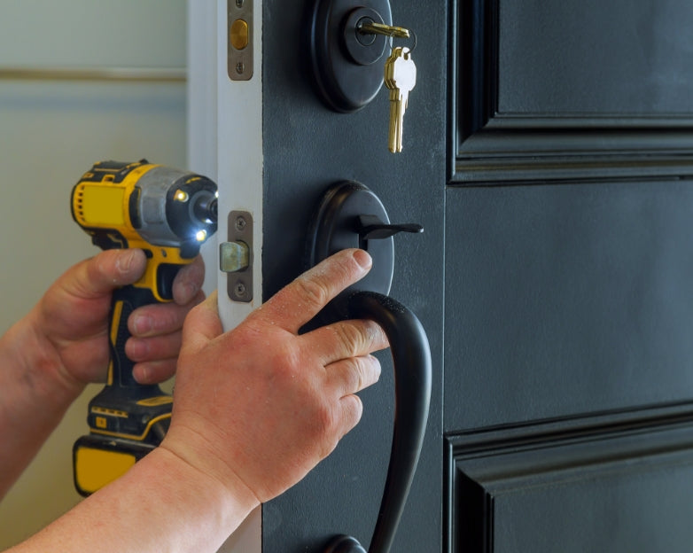 handman working on a broken lock